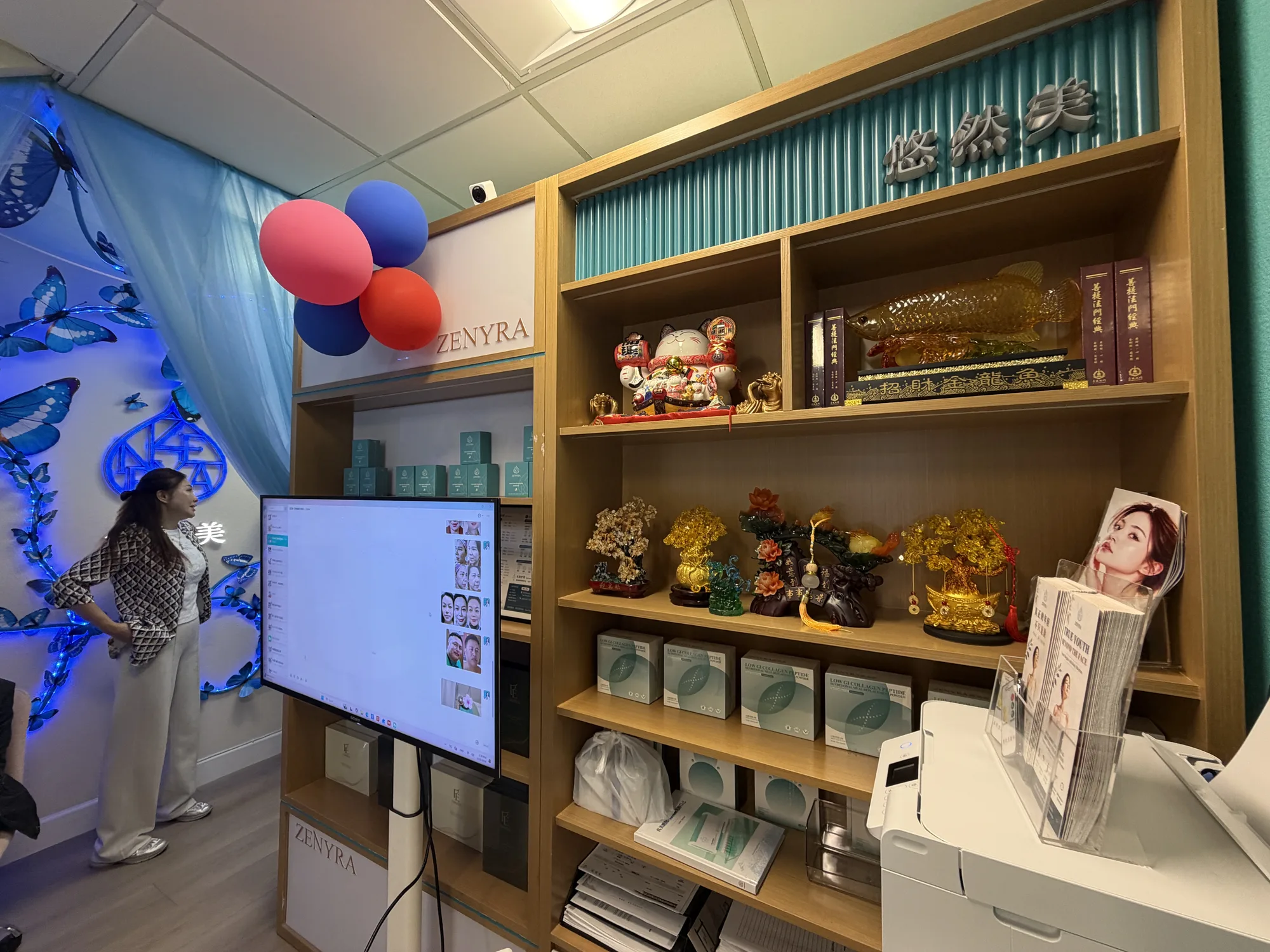 Zenyra retail and community area with teal wall panels and warm wood shelving