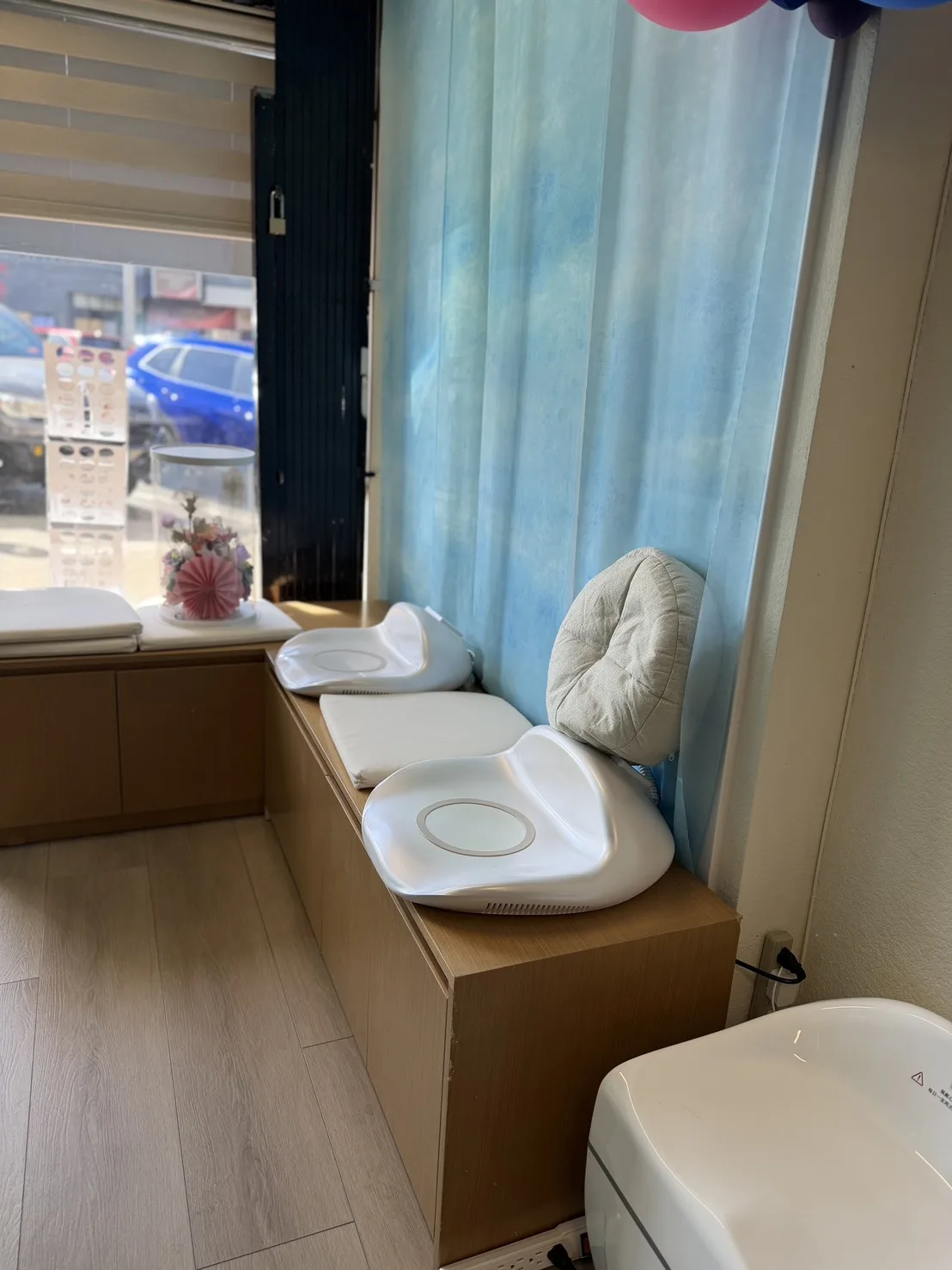 Quiet window-side wellness seat with aqua curtain